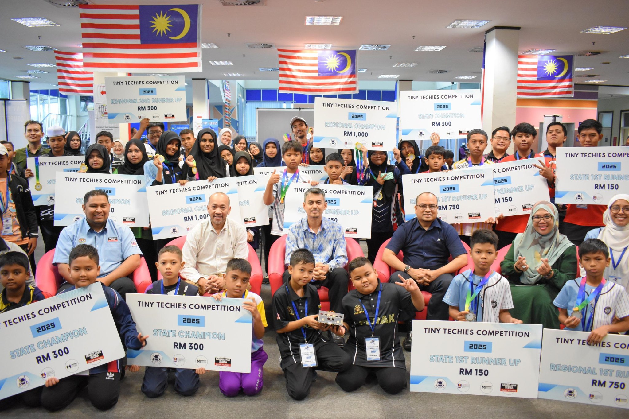 Winners and volunteers at the Tiny Techies robotics competition 2025